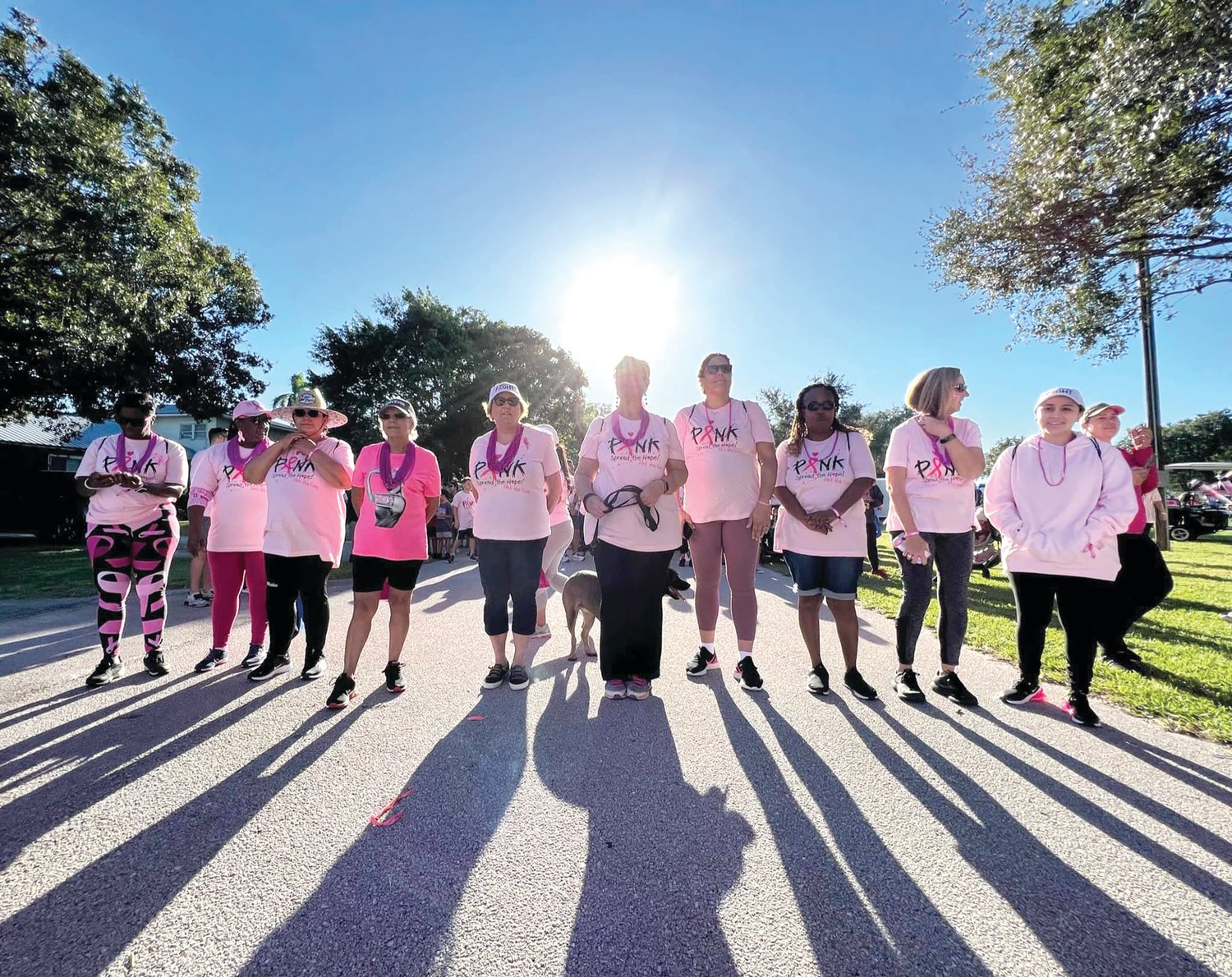 Bradshaw (3rd from Right) stands at the starting line of the Pink Warriors Walk along with other breast cancer survivors.